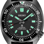 Seiko divers watch with luminous dial, unidirectional bezel, and durable rubber strap.