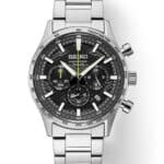 Elegant Seiko watch with stainless steel case, black textured dial, and tachymetric scale.