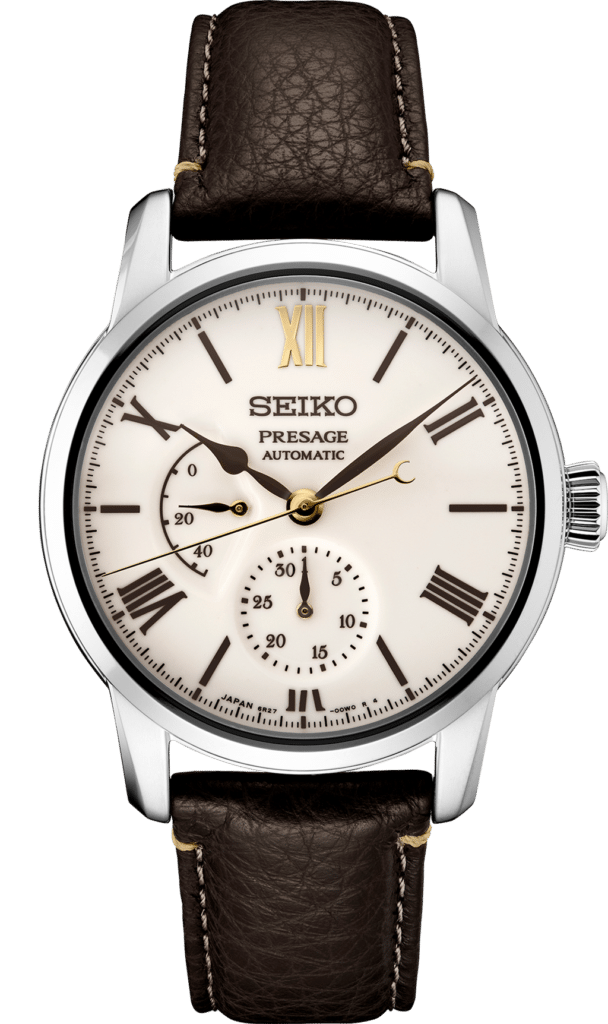 Elegant Seiko Presage automatic watch with ivory dial and luxury gold accents on a leather strap.