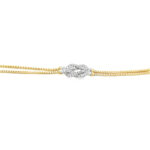 Elegant gold and diamond bracelet with a unique silver knot clasp, perfect for any occasion.