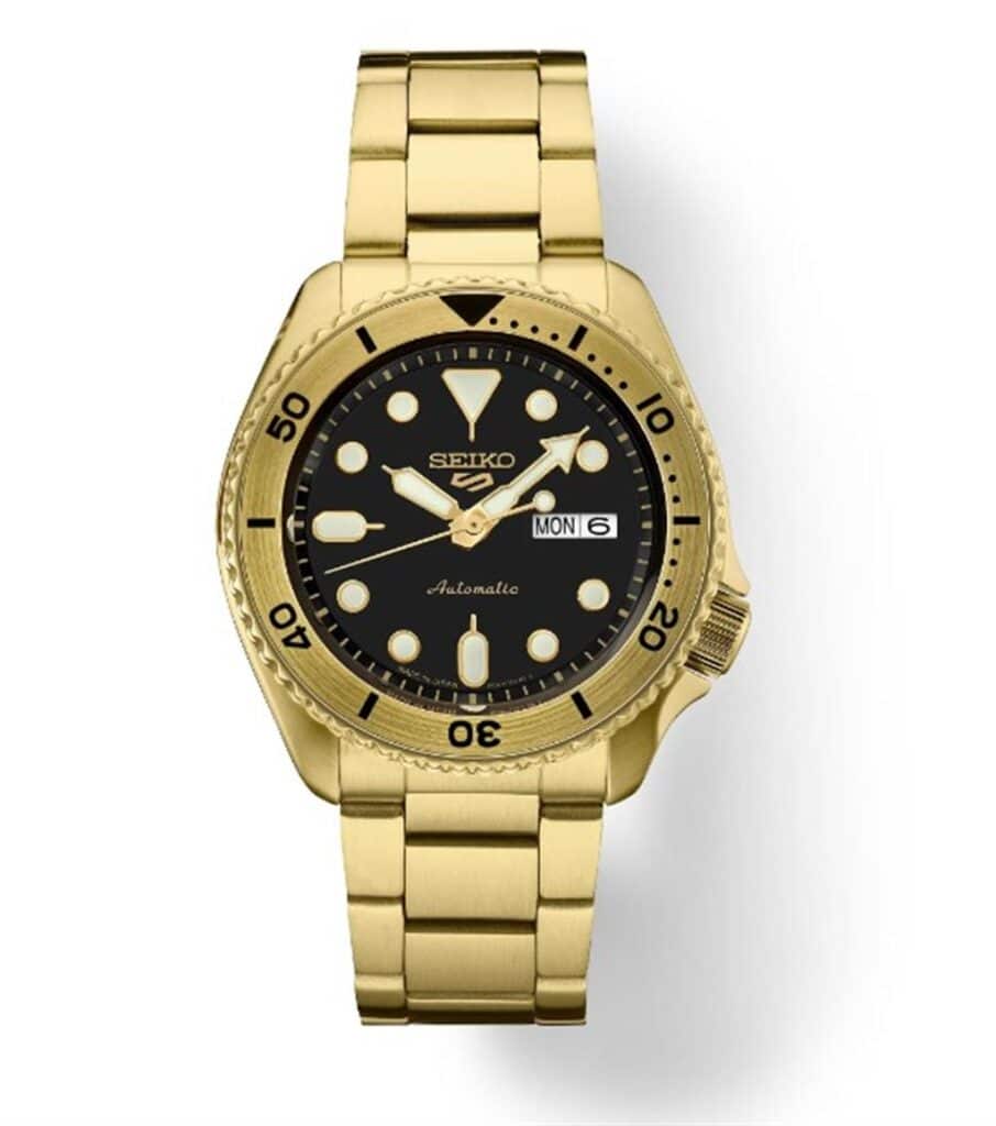 Luxury Seiko automatic watch with gold tone stainless steel bracelet and elegant black dial.