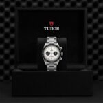 Elegant Tudor chronograph watch in luxurious black box, showcasing timeless craftsmanship and style.