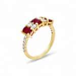 Elegant gold ring featuring red rubies and diamonds, perfect for luxurious occasions.