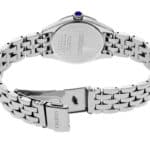 Seiko stainless steel watch featuring a blue cabochon crown and intricate metal bracelet design.