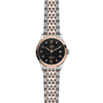 Elegant Tudor watch with stainless steel and rose gold features, showcasing luxury and sophistication.