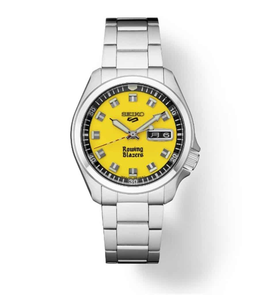 Bright yellow Seiko watch with stainless steel bracelet, featuring luminescent markers and date function.