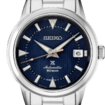 Elegant Seiko automatic watch with navy dial, stainless steel case, and luminescent markers.