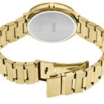 Elegant gold Seiko wristwatch with an oval case and interlocking link band, showcasing luxury.