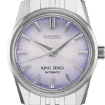 Stainless steel Seiko watch with a gradient lavender-purple dial and modern design.