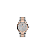 Tudor stainless steel wristwatch with rose gold bezel and elegant light gray textured dial.