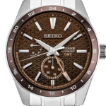 Elegant Seiko Presage GMT watch with brown textured dial and stainless steel bracelet.