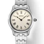 Elegant Seiko watch with classic design, stainless steel case, and vintage Roman numeral dial.
