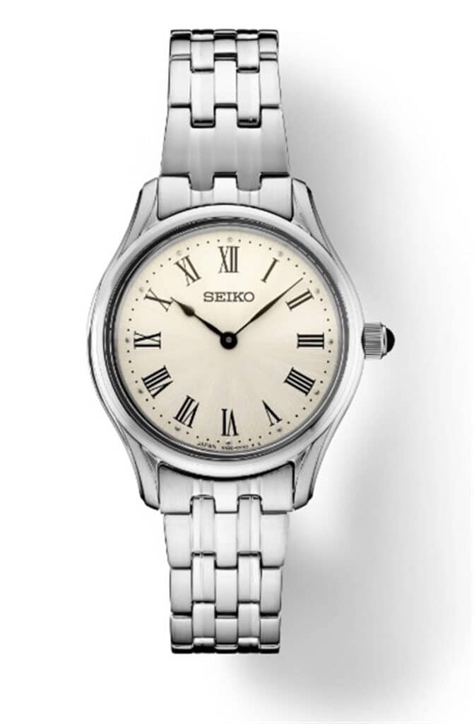 Elegant Seiko watch with classic design, stainless steel case, and vintage Roman numeral dial.