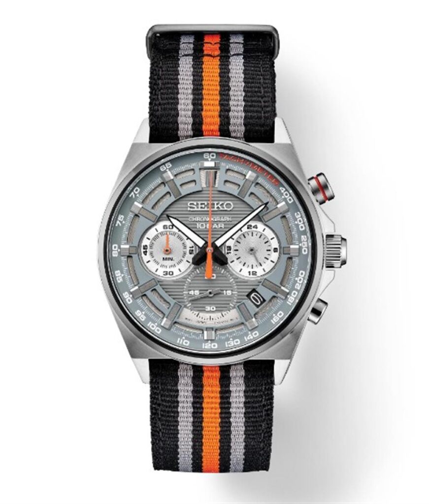 Seiko chronograph watch with stainless steel case and sporty fabric strap in gray and orange.