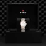 Elegant Tudor watch in luxury box, showcasing prestigious design and high-quality craftsmanship.