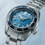Seiko dive watch with blue dial, luminous markers, and stainless steel bracelet for underwater adventures.