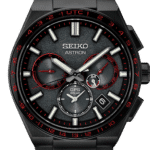 Stylish Seiko Astron watch with GPS, solar power, and striking black-and-red design.