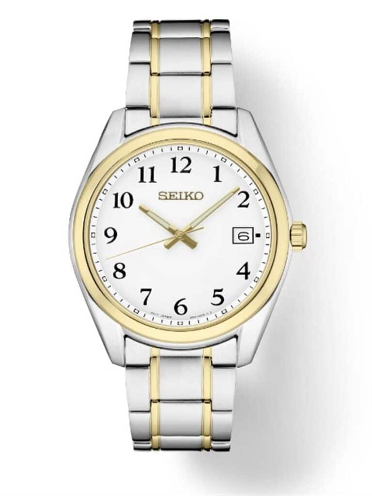 Elegant Seiko watch with two-tone stainless steel bracelet and minimalist white dial design.