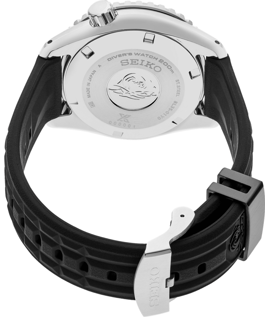 Seiko 200M divers watch back, stainless steel, engraved wave design, high-quality Japanese craftsmanship.