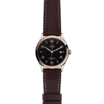 Elegant Tudor watch with stainless steel and rose gold design, featuring a black textured dial.