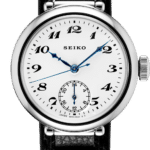 Elegant Seiko watch with stainless steel case, minimalist white dial, and black leather strap.