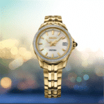 Elegant Seiko Coutura watch with gold-tone stainless steel and shimmering mother-of-pearl dial.