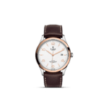 Elegant Tudor watch with stainless steel case, textured dial, rose gold hands, and leather strap.