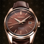 Elegant Seiko Presage automatic watch in rose gold with brown leather strap and textured dial.