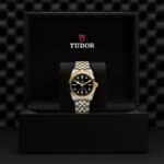Elegant Tudor watch in a sleek presentation box, showcasing luxury and timeless craftsmanship.