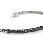 Elegant braided metal bracelet with black stone accents for stylish jewelry enthusiasts.