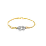 Elegant gold and silver bracelet with a sparkling knot centerpiece, perfect for all occasions.