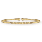 Elegant gold bracelet with minimalist design and polished beads, ideal for any occasion.