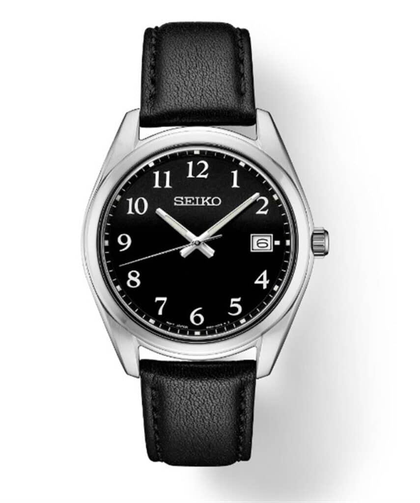 Elegant Seiko wristwatch with black dial, date function, and polished silver stainless steel case.