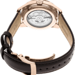 Seiko rose gold watch with transparent back showcasing intricate mechanical movement and luxury design.