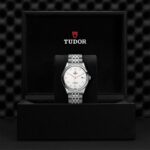 Luxury Tudor watch displayed in an elegant box with a silver stainless steel design.