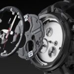 Disassembled G-Shock watch showcasing intricate components and rugged design against a black background.
