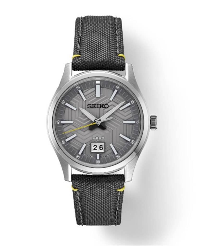 Seiko stainless steel watch with gray dial, luminescent markers, and durable fabric strap.