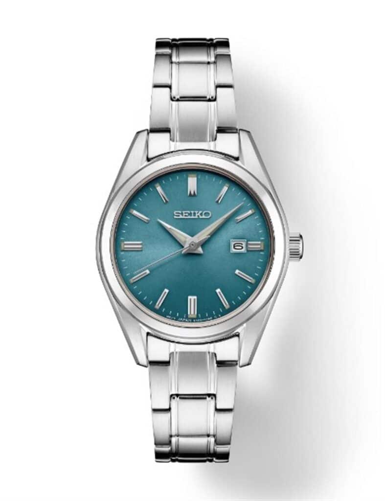 Elegant Seiko wristwatch with a turquoise dial, featuring a silver case and stylish stainless steel bracelet.