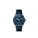 Tudor dive watch with blue dial, stainless steel case, and luxurious navy leather strap.