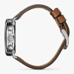 Elegant stainless steel wristwatch with a luxurious leather strap, showcasing modern design and functionality.