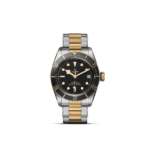 Elegant Tudor diving watch with two-tone bracelet and black dial, showcasing luxury and functionality.