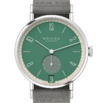 Nomos Glashütte watch features a vibrant green dial and modern stainless steel design.