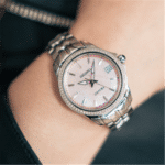 Elegant pink watch with silver bracelet and crystal accents, perfect for any occasion.