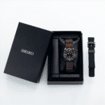 Luxury Seiko watch in black box with dual strap options for style and functionality.