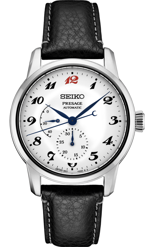 Elegant Seiko Presage automatic watch with silver case, black leather strap, and vibrant red accents.