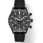 Sleek black Seiko chronograph watch with textured dial and sporty fabric strap.