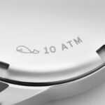 Sleek stainless steel watch back with water resistance, whale engraving, perfect for aquatic adventures.