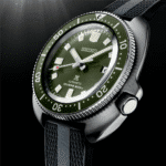 Seiko divers watch with green dial, stainless steel case, and rubber strap for underwater exploration.