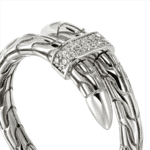 Elegant snake bracelet with polished silver, intricate clasp, and sparkling gemstones for stylish appeal.