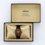Seiko Presage limited edition watch in elegant box with rich red dial and gold accents.